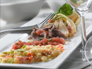 Sémola con verduras y anchoas. Semolina with vegetables and anchovies.