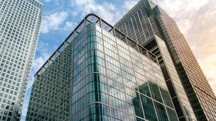 Plakat Modern city building architecture with glass fronts on a clear day in London, England at sunrise