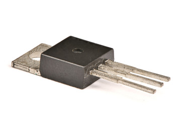 Electronic transistor isolated on white background.