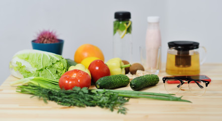 vegetables close-up on a wooden table-tomatoes, cabbage, pepper, cucumbers, herbs, kefir. Health food