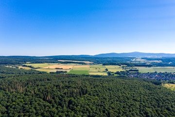 Fototapeta na wymiar Aerial view, Agricultural areas, Meadows, forests. Hesse, Germany