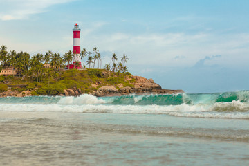  Lighthouse beach at Trivandrum, India. Blue hues and Travel photo.  . Holiday in Beautiful Kerala. Coastline of Kovalam.