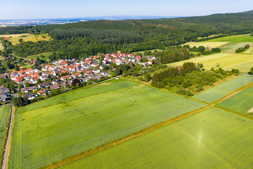Fototapeta na wymiar Aerial view, Agricultural areas, Meadows, forests. Hesse, Germany