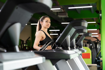 Fototapeta na wymiar Young woman workout in gym healthy lifestyle