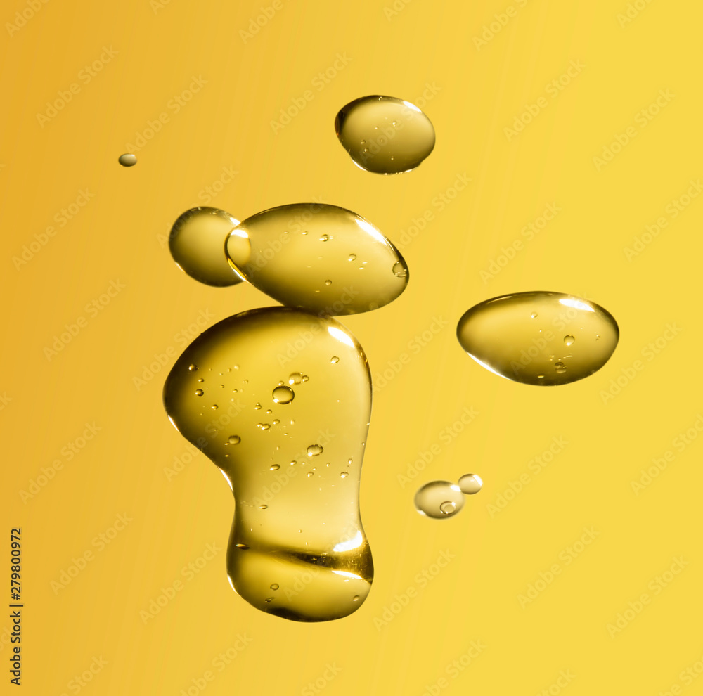 Wall mural golden yellow bubble oil droplet, abstract background