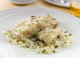 Merluza en salsa con arroz.  Hake in sauce with rice.