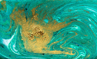 Green and gold marbling pattern. Golden powder marble liquid texture.