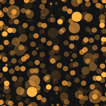 golden lights bokeh and sparkles. Isolated on a black background