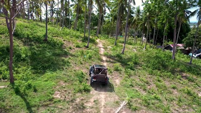 Samui / Thailand - 06 02 2019: Wrangler without a roof travels through the jungle of Thailand