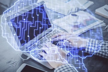 Double exposure of forex chart with man working on computer on background. Concept of market analysis.