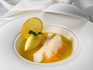 postre gourmet de mandarina con helado de limón. mandarin gourmet dessert with lemon ice cream.