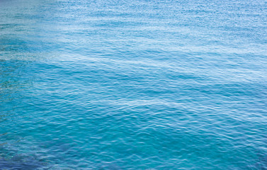 natural simple background of calm and peaceful blue water surface 