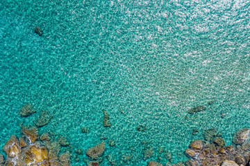 Aerial view of beautiful rocky coastline. Seashore and the ocean. Rocks and stone by the sea.