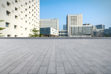 Fototapeta na wymiar Modern architecture with empty concrete plaza at shenzhen university in China