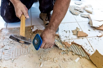 Worker demolitions old tile