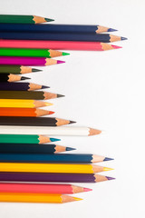 Fototapeta premium Diversity concept. Colored Pencils on isolated white backround