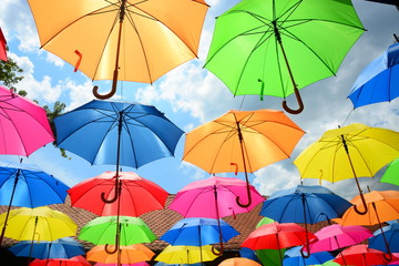 Obraz na płótnie Canvas colorful umbrellas on the background of blue sky