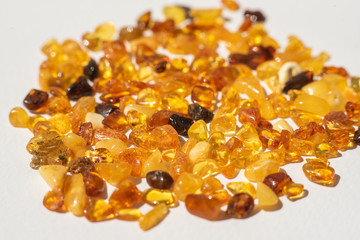 yellow amber stones on white background