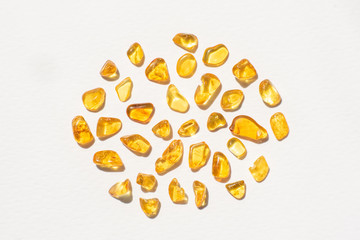 yellow amber stones on white background