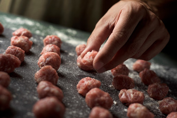 man preparing meatballs