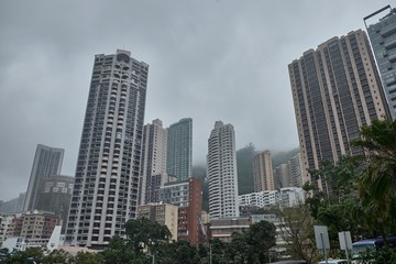 Fototapeta premium 08 03 2019 Hong Kong, China - high-rise buildings and cloudy sky