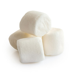 Pile of four white mini marshmallows isolated on white.