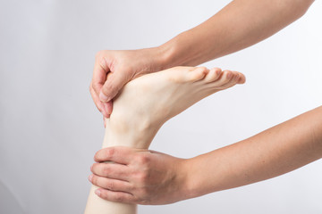 Close-up of female hands doing foot massage