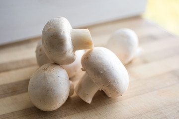 fresh mushrooms on a cutting board