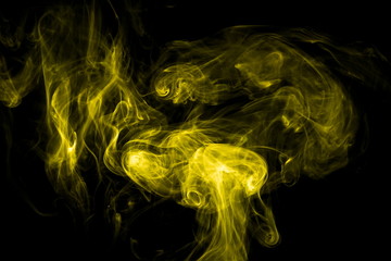 Yellow smoke on black background