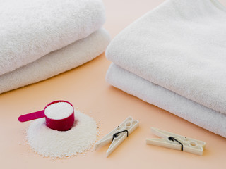 Close-up white folded clean towels with clothes pin