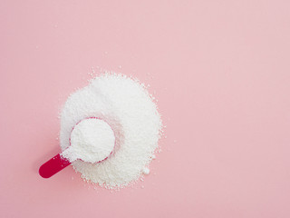 Flat-lay detergent powder on colorful background
