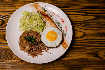 Millet porridge with meat, chopped eggs