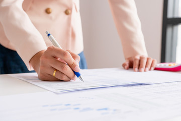 Business man calculate about cost and doing finance at office, Finance managers task, Concept business and financial investment