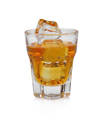 Glass of scotch whiskey and ice on  white background