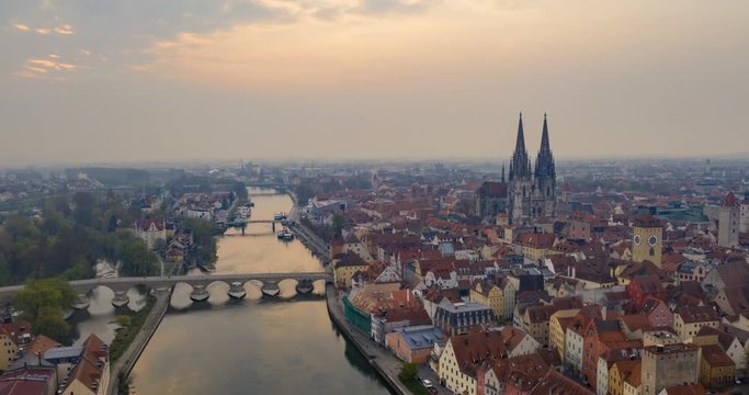 Aerial hyperlapse flying above Bridge Church and Regensberg, Germany.
