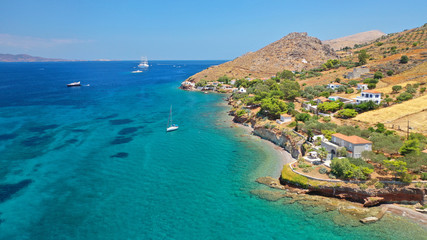 Fototapeta na wymiar Aerial drone photo of small beach of Vlycho with clear turquoise sea in picturesque island of Ydra or Hydra, Saronic gulf, Greece