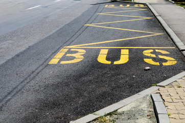 Yellow bus stop road marking .