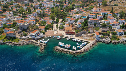 Aerial drone photo of small picturesque seaside fishing village of Kamini in picturesque island of Ydra or Hydra, Saronic gulf, Greece