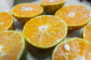 Fototapeta na wymiar Background of half cut oranges background,soft focus.
