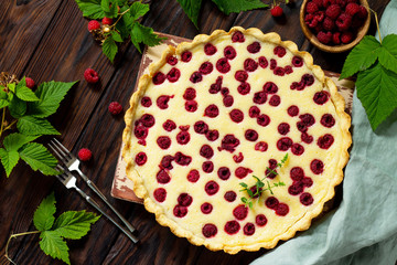 Berry pie summer. Sweet pie, tart with fresh berry raspberries. Delicious cake with raspberries. Top view flat lay.