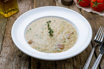 risotto with porcini mushrooms on wooden table