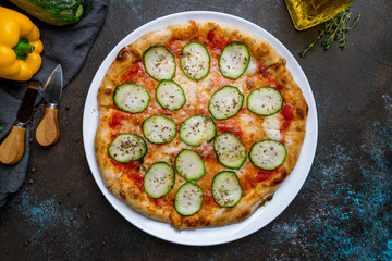 Pizza with vegetables vegetarian on dark concrete background