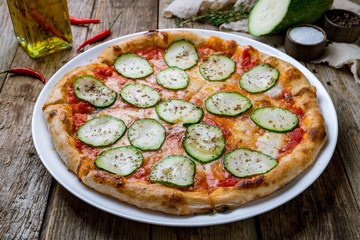 Pizza with vegetables vegetarian on wooden table