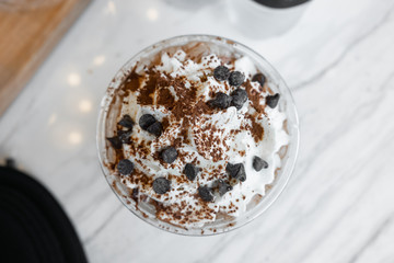 Top view whipping cream with chocolate in the cup.