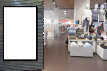 blank showcase billboard or advertising light box for your text message or media content with blurred image popular women fashion clothes shop showcase in shopping mall, commercial, marketing concept