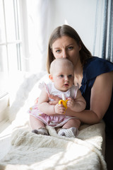 Mother is Holding and Hugging His Baby Daughter