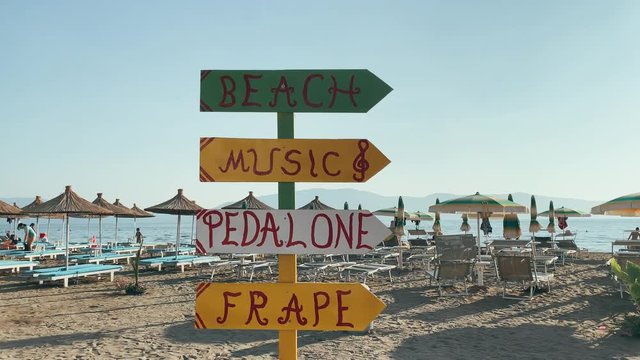 Wooden sign on the beach 4k