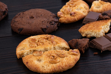 Chocolate cookies on wooden table. Homemade food on wooden background