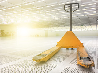 Old yellow hand lift or stacker in clean room 