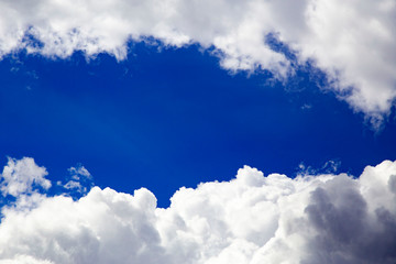 In the sky with white clouds.